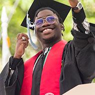 Student in graduation cap and gown.